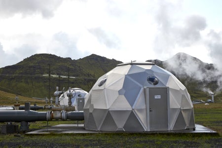 Silver pod domes in landscape with pipes